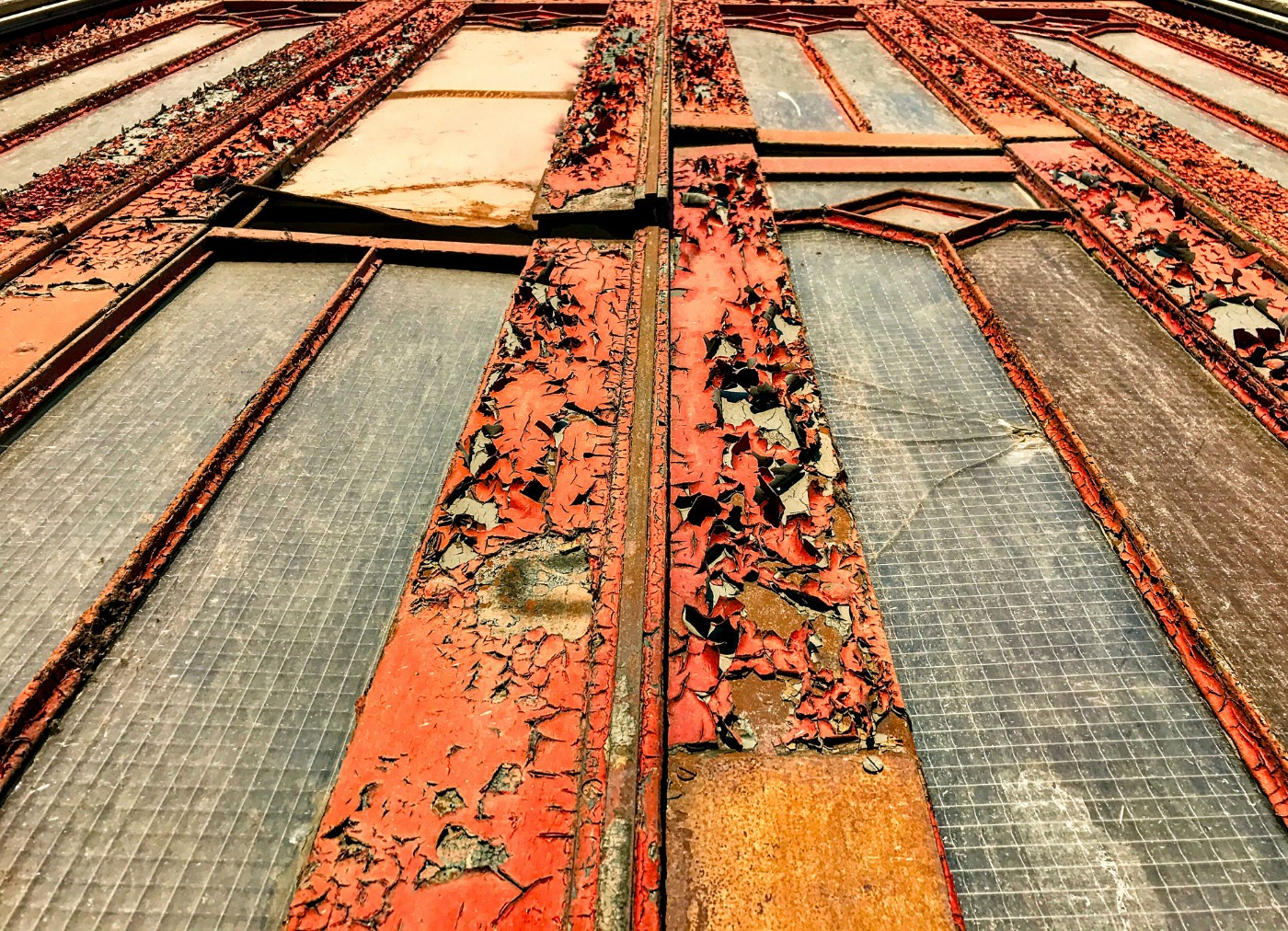 Flaking paint on old metal window frames